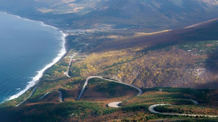 Behold the Lush Mountains and Majestic Coastline